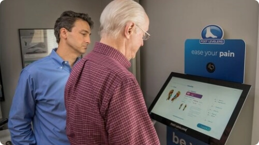 Dr. todd guiding a patient through a custom orthotics digitial foot scan