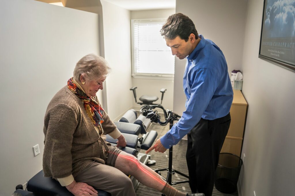 Dr. Todd administers Therapeutic Laser on a patient's knee 