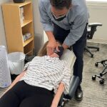 Dr. Todd adjusting various patient's necks to treat neck pain