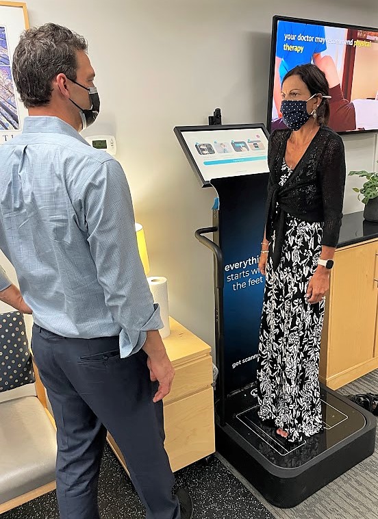 Dr. Todd evalutating posture using our digital 3-D foot scan